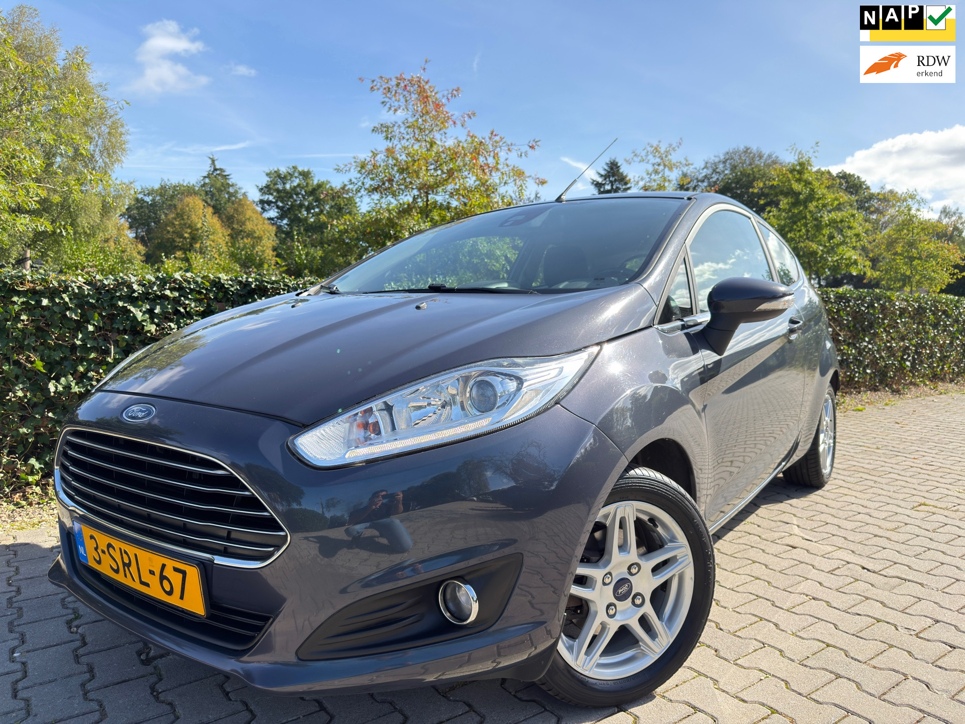 Ford Fiesta 1.0 EcoBoost Titanium , Clima / Cruise / Navi-Multimedia / Elec.Pakket / Isofix / Led / Pdc / 15″ Lm Velgen / Trekhaak