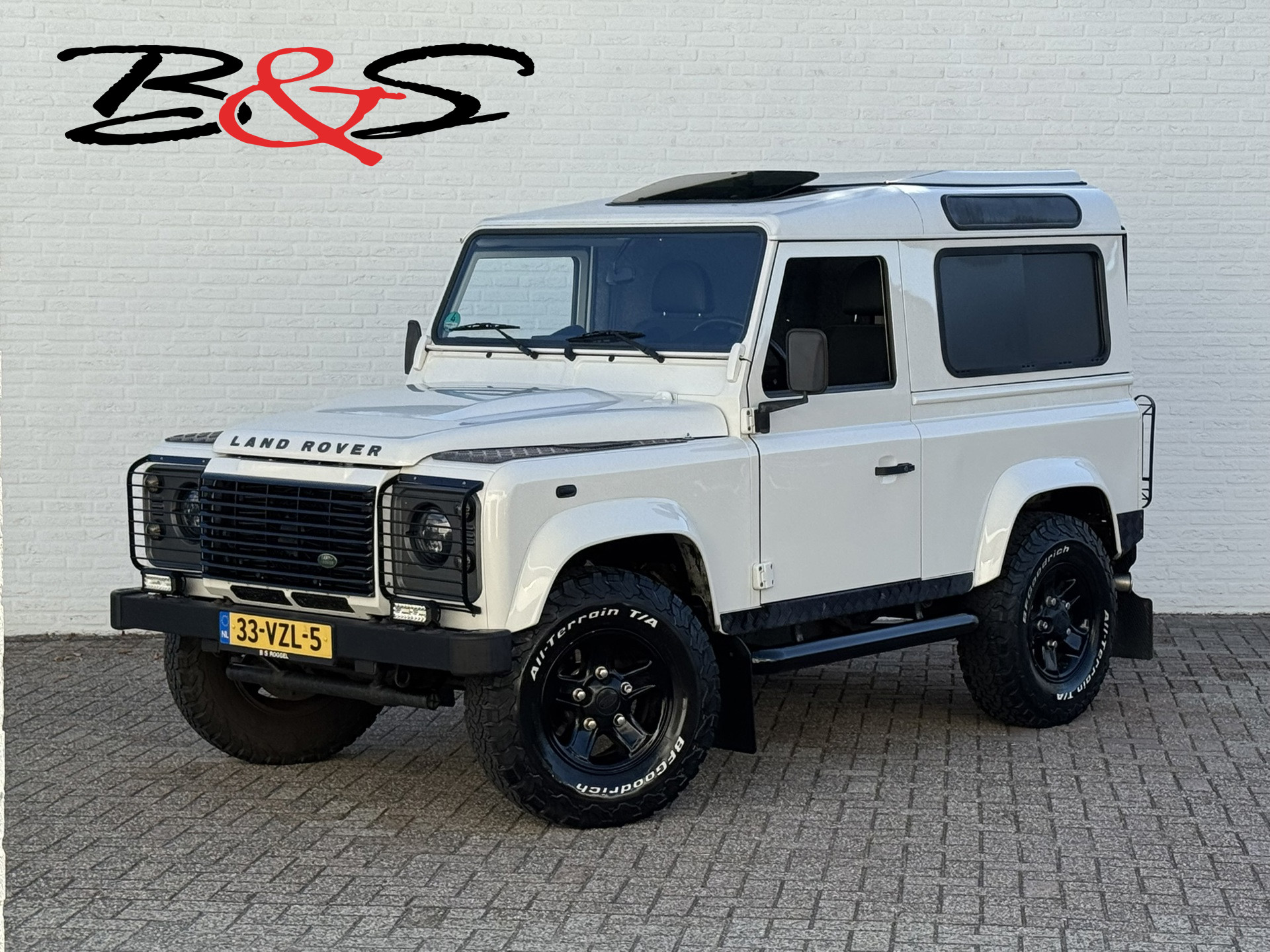 Land Rover Defender 2.4 TD HT 90″ E Marge Grijs kenteken Led Trekhaak 3500kg Airco Schuifdak Topstaat!